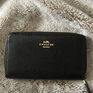 Black and gold Coach zip wallet